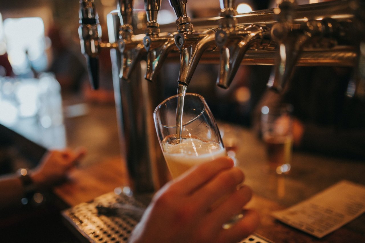 pouring beer into a glass