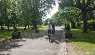 a woman cycling in a park 