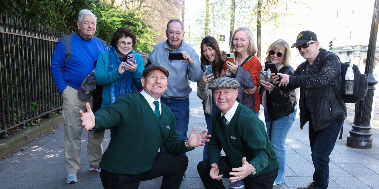 visitors posing with tour guides
